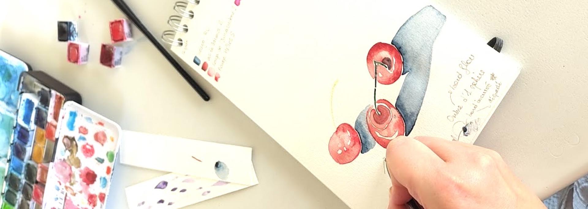 Poignée de cerises proposées à l'aquarelle lors d'un atelier