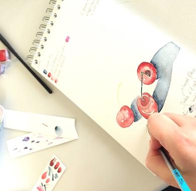 Poignée de cerises proposées à l'aquarelle lors d'un atelier